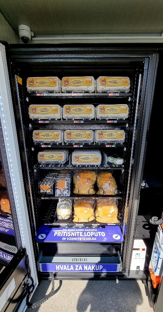 Example of an egg vending machine interior with egg cartons and additional products